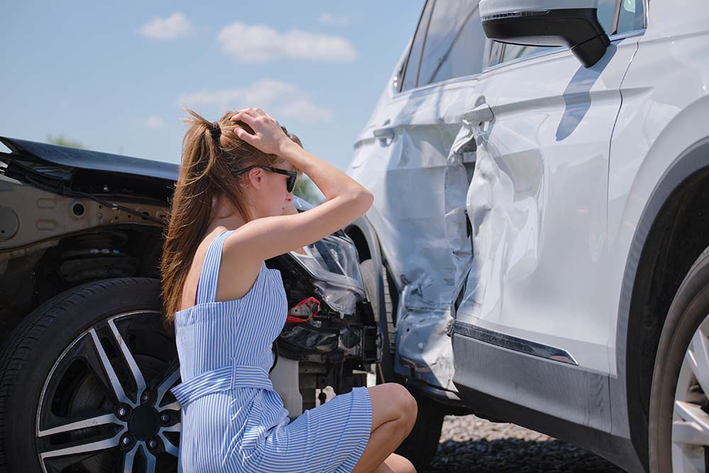 Young woman upset after a car accident