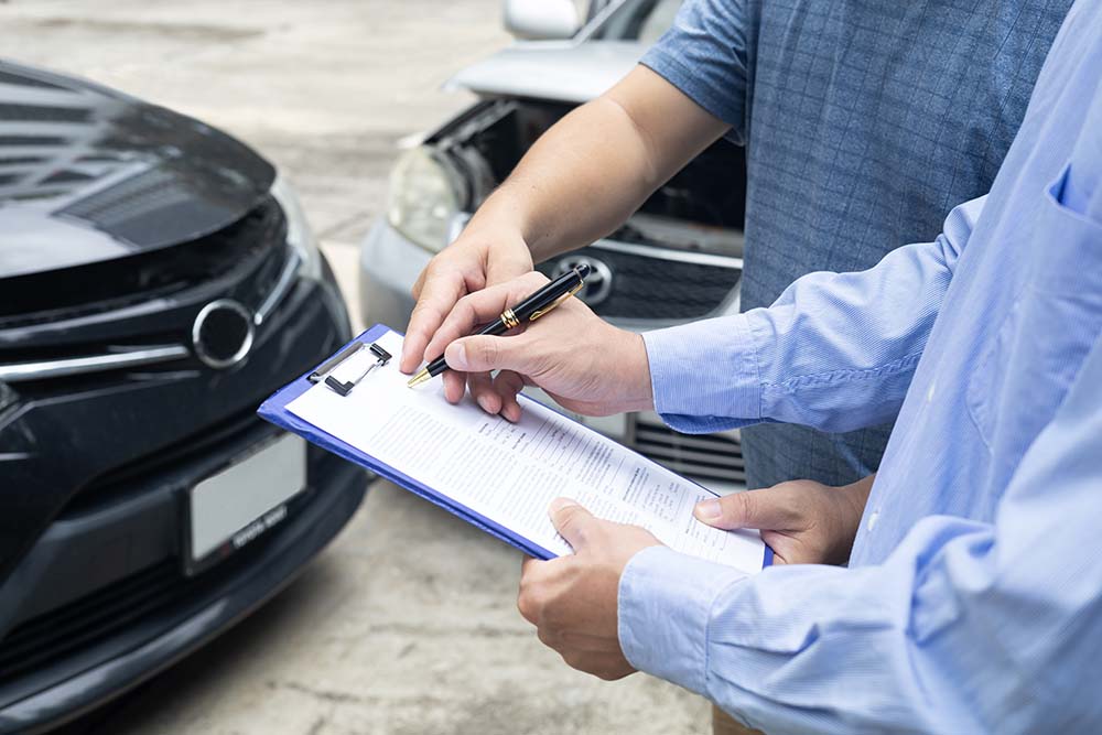 An insurance adjustor helping someone after a care accident