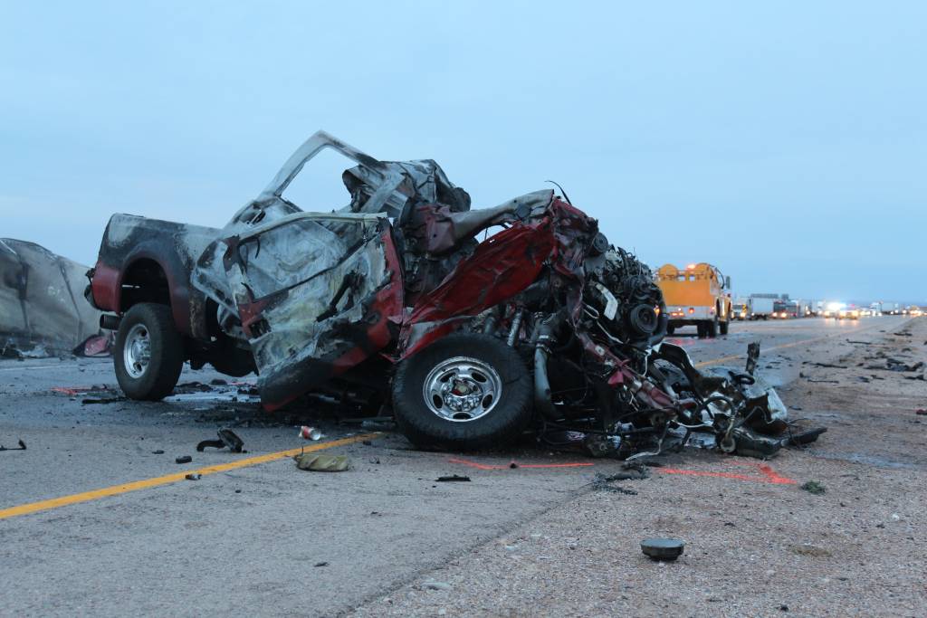 A deadly traffic accident on the interstate near San Antonio, Texas, involving multiple cars. Cars behind the crash appear backed up for miles.